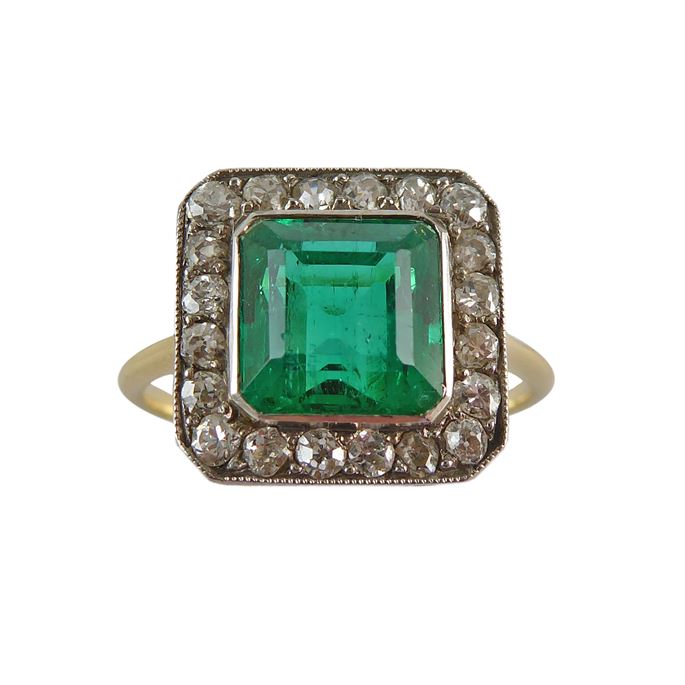 Early 20th century single stone emerald and diamond cluster ring, English c,1905, the Colombian square step-cut emerald of approximately 1.50ct, | MasterArt